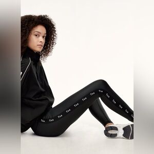 Aritzia TNA Halsam Pant Faux Leather Black Repeating Logo Side Stripe Leggings S